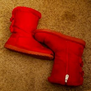 Worn out red boots